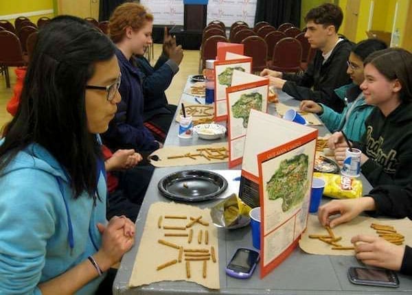 Teen Science Café Network students arranging pretzels into characters