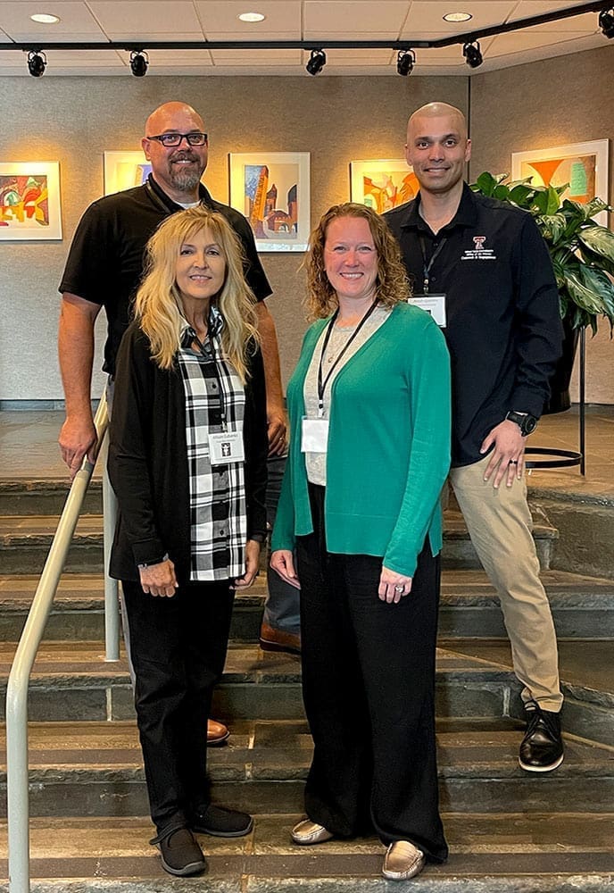 Dr. Jessica Spott, Allison Eubanks, Dr. Anish Quenim, and Dr. Rod Williams standing together, smiling at the camera.